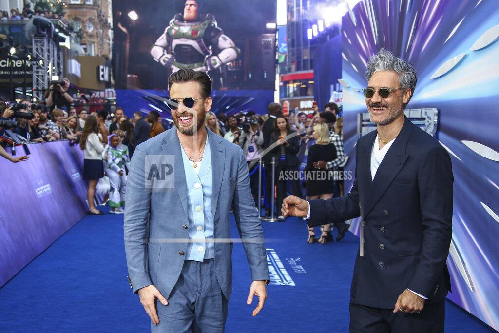 Joel C Ryan Chris Evans, left, and Taika Waititi pose for photographers upon arrival for the premiere of the film 'Lightyear' in London, Monday, June 13, 2022. (Photo by Joel C Ryan/Invision/AP)