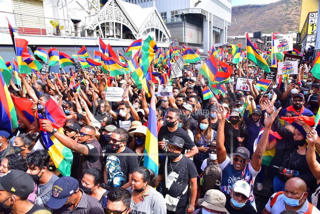 Beekash Roopun Tens of thousands of people protest in Port Louis, Mauritius, Saturday Aug. 29, 2020, over the government's slow response to an oil spill from a grounded Japanese ship and the alarming discovery of dozens of dead dolphins. (Beekash Roopun/L'express Maurice via AP)