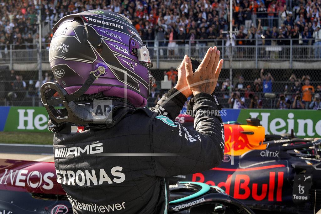 Francisco Seco Mercedes driver Lewis Hamilton of Britain celebrates after setting the second fastest time in the qualifying session for Sunday's Formula One Dutch Grand Prix at the Zandvoort racetrack, Netherlands, Saturday, Sept. 4, 2021. (AP Photo/Francisco Seco, Pool)