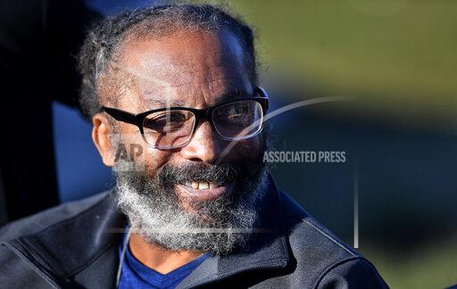 Kevin Strickland, 62, managed a smile while talking to the media after his release from prison, Tuesday, Nov. 23, 2021, in Cameron, Mo. Strickland, who was jailed for more than 40 years for three murders, was released from prison Tuesday after a judge ruled that he was wrongfully convicted in 1979. (Rich Sugg/The Kansas City Star via AP)