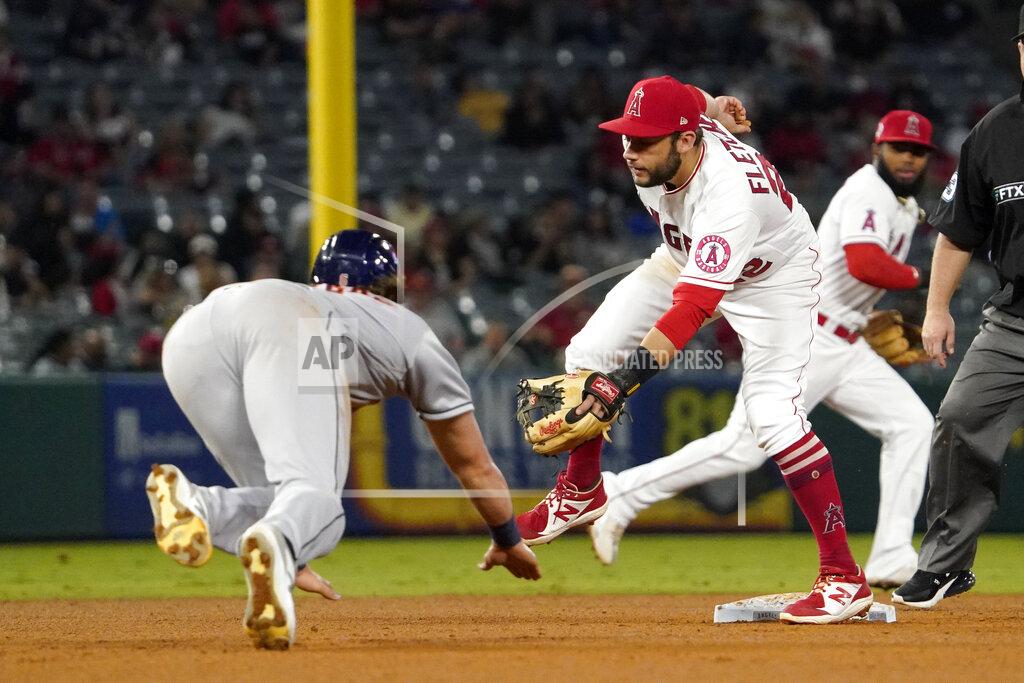 Mark J. Terrill Houston Astros' Jake Meyers, left, steals second as Los Angeles Angels third baseman David Fletcher waits for a the ball that ended up going over his head during the fifth inning of a baseball game Thursday, Sept. 23, 2021, in Anaheim, Calif. (AP Photo/Mark J. Terrill)