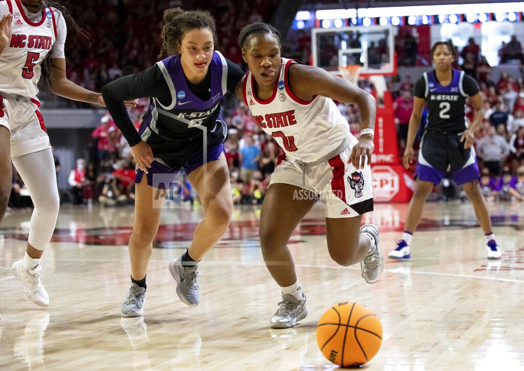 Ben Mckeown North Carolina State's Diamond Johnson (0) and Kansas State's Brylee Glenn (5) chase the ball during the second half of a college basketball game in the second round of the NCAA tournament in Raleigh, N.C., Monday, March 21, 2022. (AP Photo/Ben McKeown)