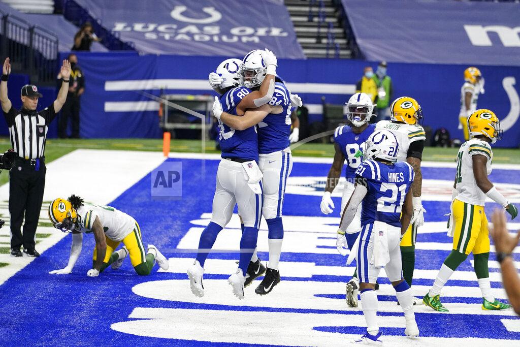 Michael Conroy Indianapolis Colts' Trey Burton (80) celebrates a touchdown reception with Jack Doyle (84) during the first half of an NFL football game against the Green Bay Packers, Sunday, Nov. 22, 2020, in Indianapolis. (AP Photo/Michael Conroy)