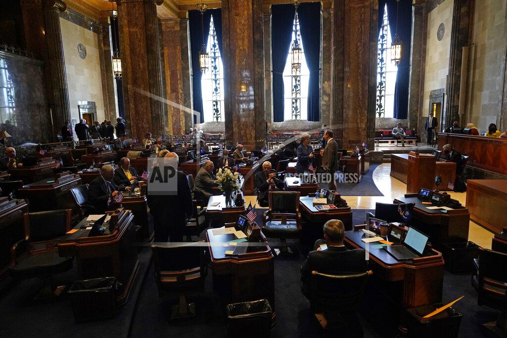 Gerald Herbert Lawmakers convene in the Senate Chambers during opening day of the Louisiana legislative session in Baton Rouge, La., Monday, April 12, 2021. (AP Photo/Gerald Herbert)