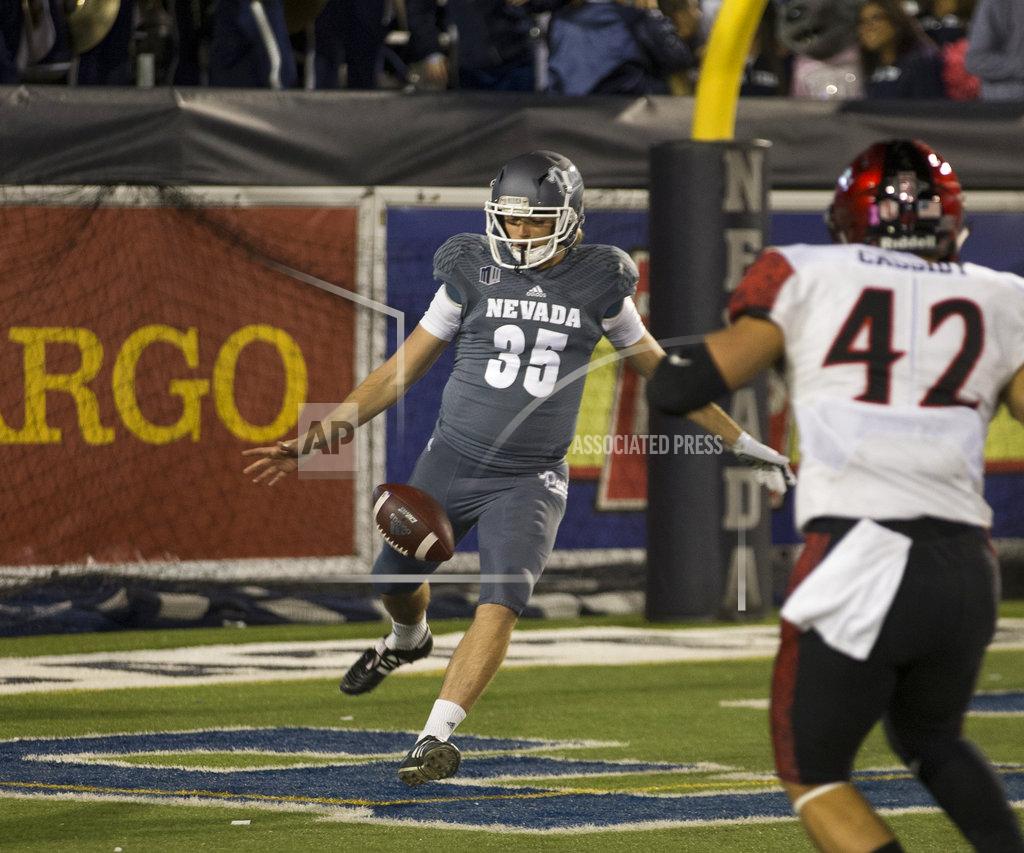 Tom R. Smedes Nevada kicker Quinton Conaway (35) punts out of his own end zone against San Diego State in the first half of an NCAA college football game in Reno, Nev., Saturday, Oct. 27, 2018. (AP Photo/Tom R. Smedes)