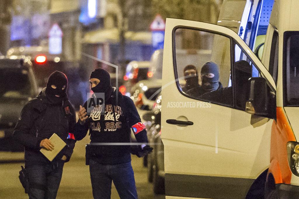 Geert Vanden Wijngaert FILE - In this April 8, 2016 file photo police investigate an area where terror suspect Mohamed Abrini was arrested earlier today, in Brussels. The federal prosecutor's office confirmed a fugitive suspect in the Nov. 13 Paris attacks was arrested in Belgium on Friday, after a raid Belgian authorities said was linked to the deadly March 22 Brussels bombings. The suspect, Mohamed Abrini, is believed to be the mysterious "man in the hat" who escaped the double bombing at Brussels airport, but further investigation is needed to determine Abrini is the third suspect of the airport attack. (AP Photo/Geert Vanden Wijngaert, File)