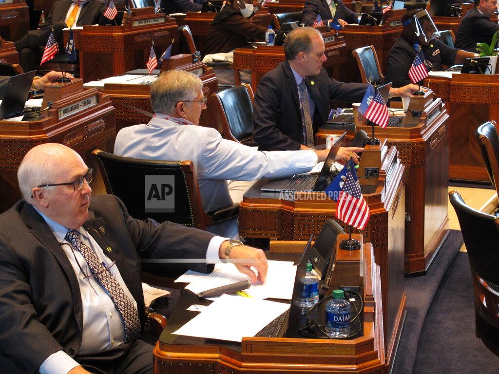 Melinda Deslatte Sens. Bodi White, R-Central, left; Eddie Lambert, R-Gonzales, center; and Franklin Foil, R-Baton Rouge, vote on bills on the Senate floor as the Louisiana Legislature wrapped up its regular session on Monday, June 1, 2020, in Baton Rouge, La. (AP Photo/Melinda Deslatte)