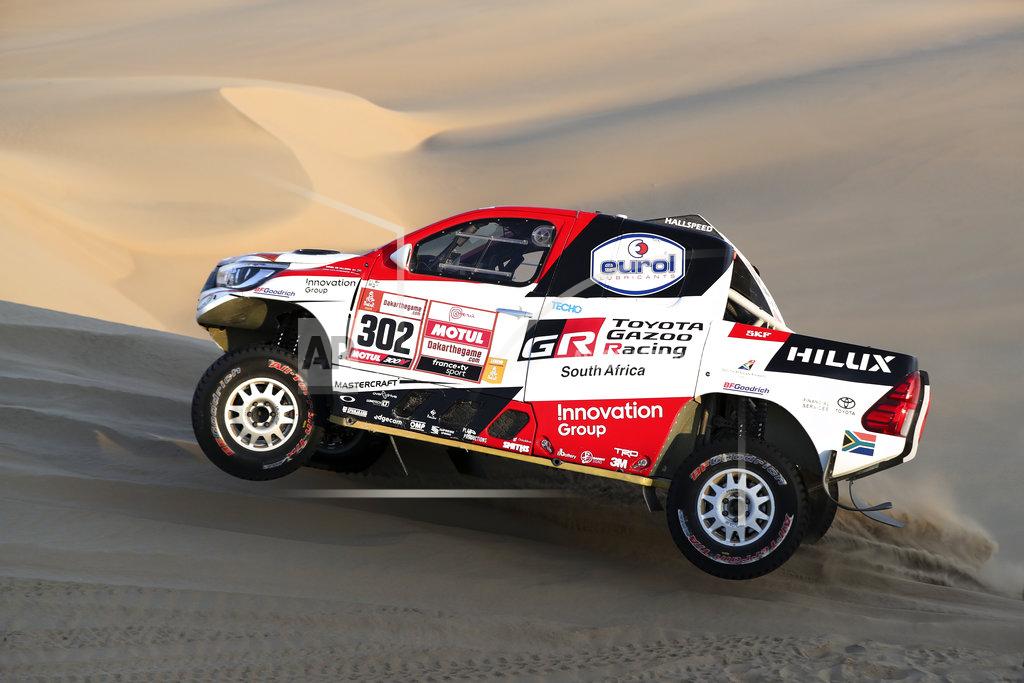Ricardo Mazalan Driver Giniel De Villiers, of South Africa, and co-driver Dirk Von Zitzewitz, of Germany, race their Toyota during the second stage of the Dakar Rally between Pisco and San Juan de Marcona, Peru, Tuesday, Jan. 8, 2019. (AP Photo/Ricardo Mazalan)