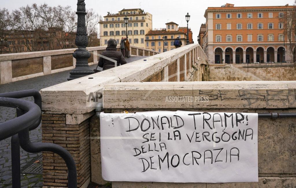 Andrew Medichini A sign is exposed on Sisto bridge in Rome reading in Italian: “Donald Tramp you are the shame of democracy.”, Thursday, Jan. 7, 2021. Italians on the street in Rome Thursday expressed shock and horror at the events on Capitol Hill in Washington Wednesday evening and cast blame on lame duck President Donald Trump. (AP Photo/Andrew Medichini)