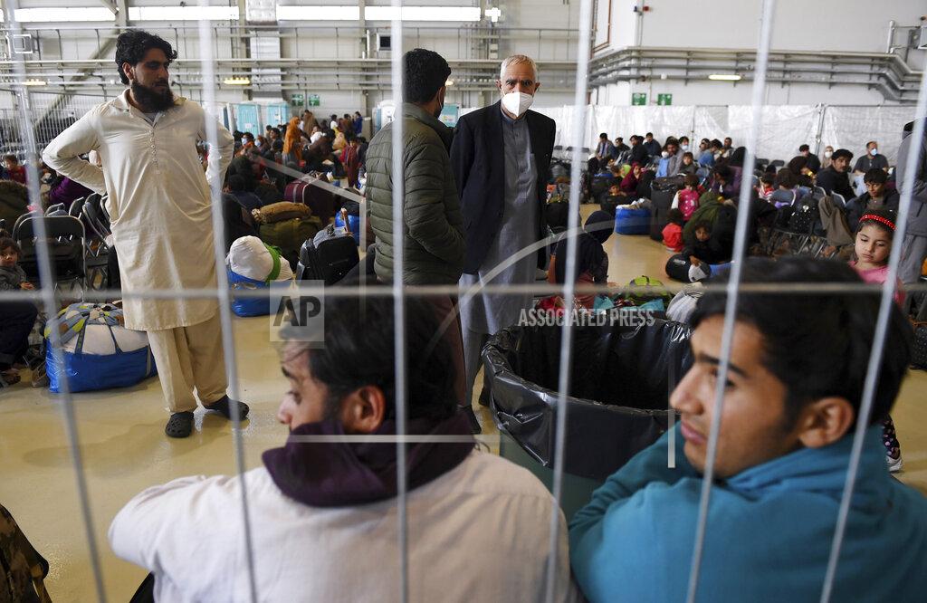 Olivier Douliery Afghan refugees are processed inside Hangar 5 at the Ramstein U.S. Air Base in Germany Wednesday, Sept. 8, 2021. U.S. Secretary of State Antony Blinken arrived at the base where he will meet with his German counterpart for talks on Afghanistan. (Olivier Douliery/Pool Photo via AP)