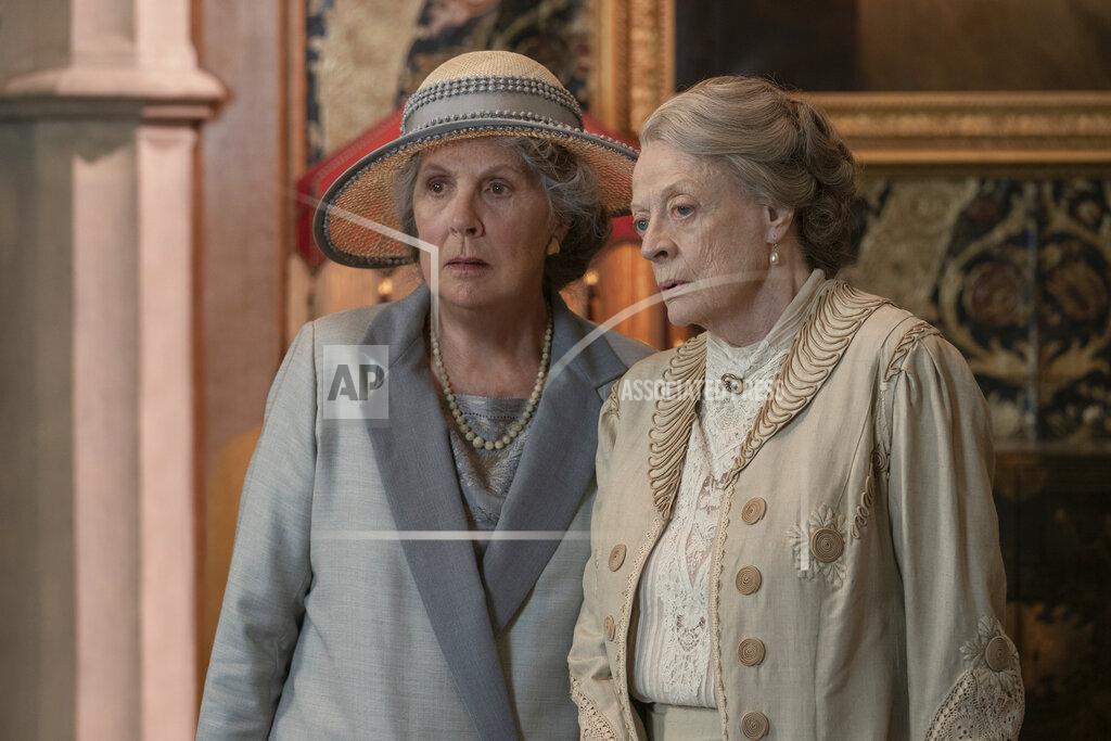 Ben Blackall This image released by Focus Features shows Penelope Wilton as Isobel Merton, left, and Maggie Smith as Violet Grantham in a scene from "Downton Abbey: A New Era." (Ben Blackall/Focus Features via AP)