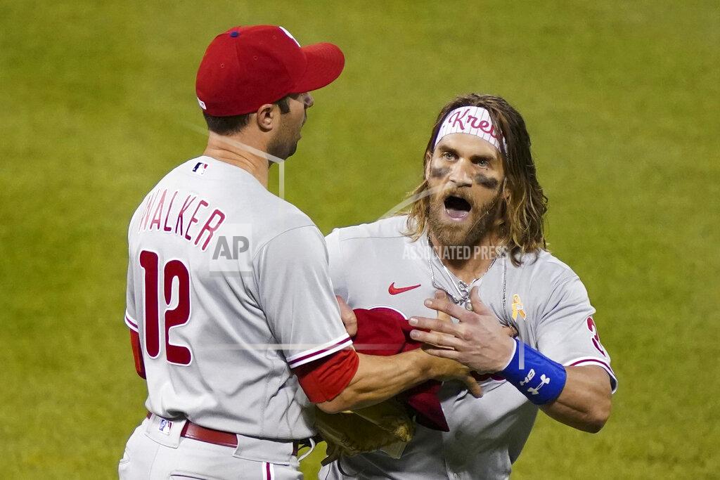 John Minchillo Philadelphia Phillies' Bryce Harper, right, reacts alongside Neil Walker (12) after being thrown out of the team's baseball game against the New York Mets by umpire Roberto Ortiz during the fifth inning Saturday, Sept. 5, 2020, in New York. (AP Photo/John Minchillo)