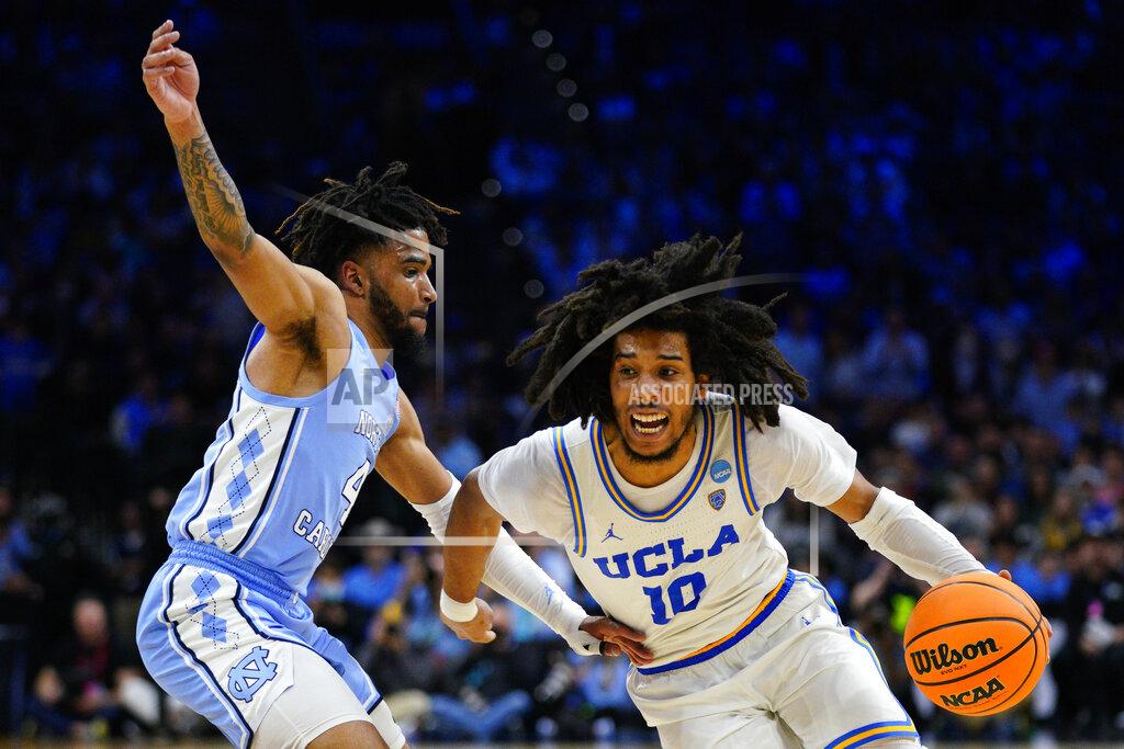 Chris Szagola UCLA's Tyger Campbell, right, drives past North Carolina's R.J. Davis during the second half of a college basketball game in the Sweet 16 round of the NCAA tournament, Friday, March 25, 2022, in Philadelphia. (AP Photo/Chris Szagola)