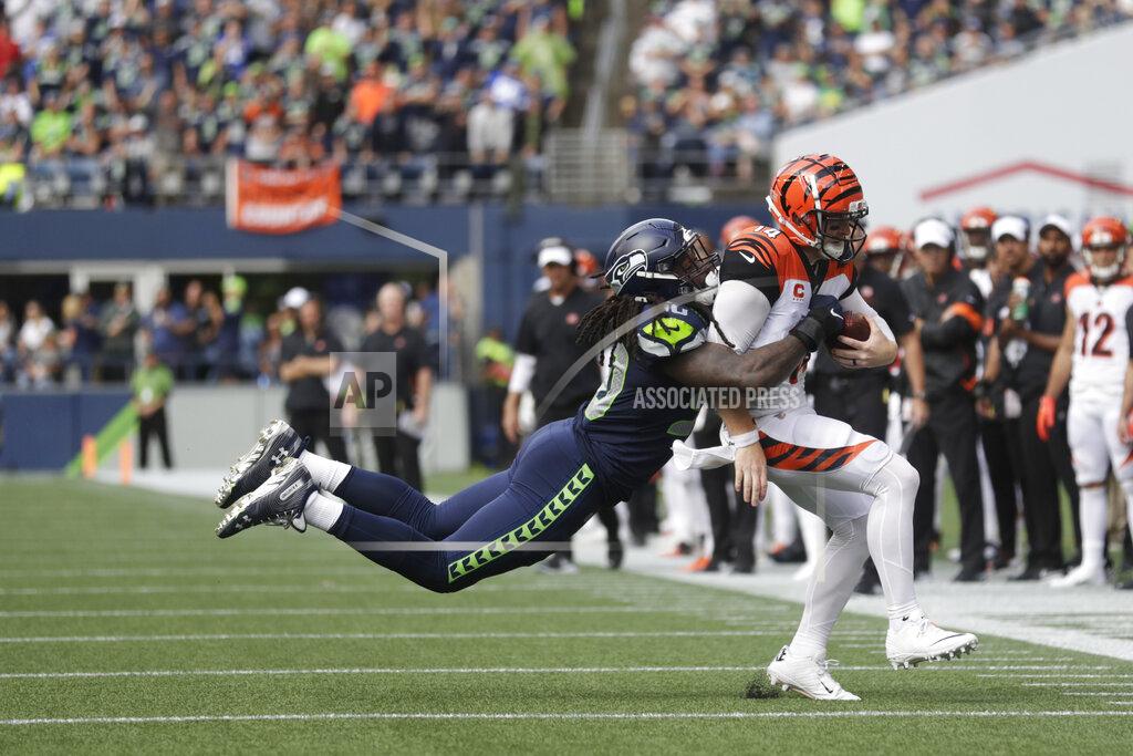 Stephen Brashear Seattle Seahawks defensive end Jadeveon Clowney, left, tackles Cincinnati Bengals quarterback Andy Dalton, right, during the second half of an NFL football game, Sunday, Sept. 8, 2019, in Seattle. (AP Photo/Stephen Brashear)