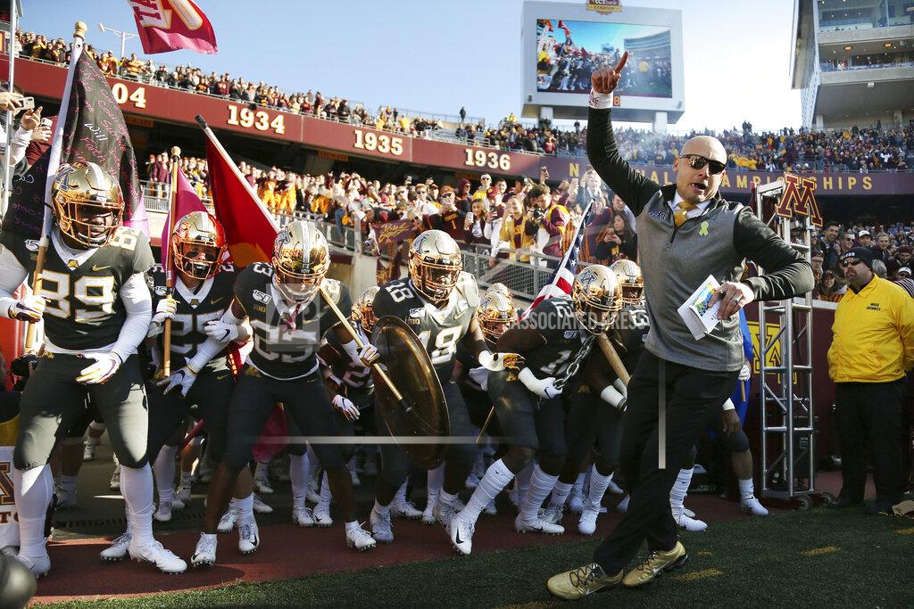 Stacy Bengs FILE - In this Oct. 26, 2019, file photo, Minnesota head coach P.J. Fleck leads him team on the field prior to an NCAA college football game against Maryland, in Minneapolis. Penn State (8-0) plays against Minnesota (8-0) on Saturday, Nov. 9. (AP Photo/Stacy Bengs, File)