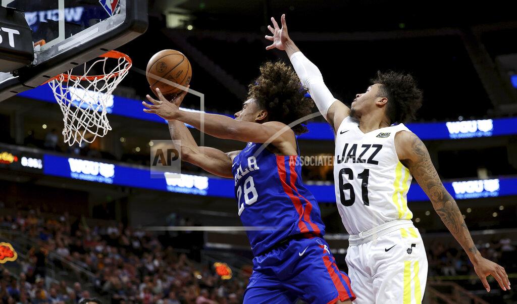 Scott G Winterton Philadelphia 76ers' Malik Ellison, goes to the basket around Utah Jazz's Caleb Homesley during an NBA summer league basketball game in Salt Lake City on Wednesday, July 6, 2022. (Scott G Winterton/The Deseret News via AP)