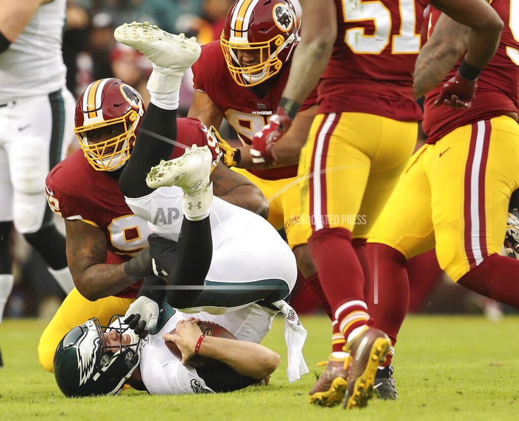 Andrew Harnik FILE - In this Sunday, Dec. 30, 2018, file photo, Washington Redskins defensive tackle Stacy McGee (92) sacks Philadelphia Eagles quarterback Nick Foles (9) during the first half of the NFL football game, in Landover, Md. On Wednesday, March 13, 2019, the Redskins released linebacker Zach Brown and defensive lineman Stacy McGee as part of a remaking of their defense. (AP Photo/Andrew Harnik, File)