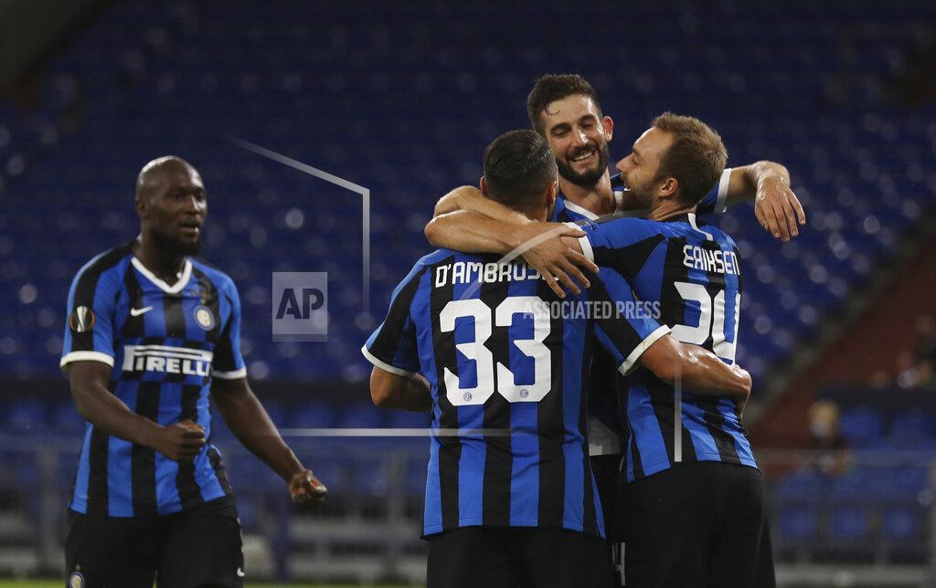 Lars Baron Inter Milan's Christian Eriksen, right, celebrates with teammates after scoring his sides second goal of the game during the Europa League round of 16 soccer match between Inter Milan and Getafe at the Veltins-Arena in Gelsenkirchen, Germany, Wednesday, Aug. 5, 2020. (Lars Baron, Pool Photo via AP)