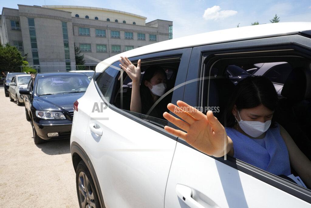 Ahn Young-Joon Christians inside their car pray during a drive-in worship service amid measures to help prevent the spread of the coronavirus at the Songgok high school in Seoul, South Korea, Sunday, July 25, 2021. (AP Photo/Ahn Young-joon)