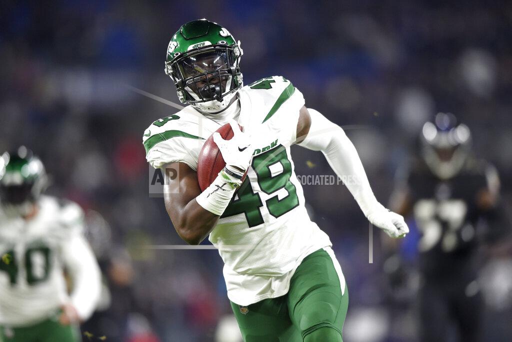 Gail Burton New York Jets linebacker B.J. Bello (49) returns a blocked punt for a touchdown during the second half of an NFL football game against the Baltimore Ravens, Thursday, Dec. 12, 2019, in Baltimore. (AP Photo/Gail Burton)