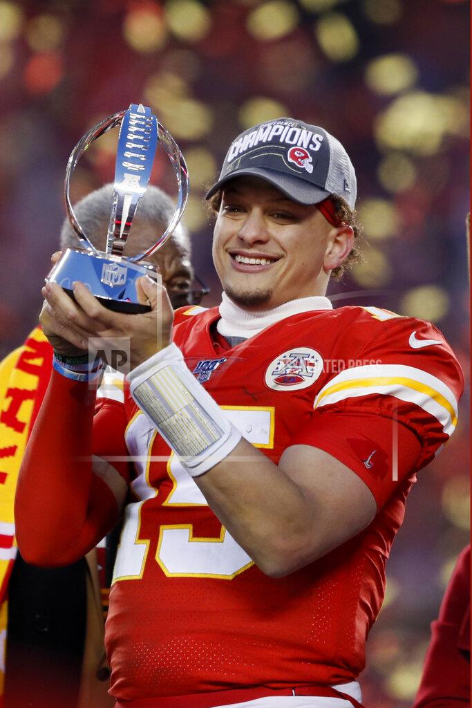 Charlie Neibergall Kansas City Chiefs' Patrick Mahomes holds up the Lamar Hunt Trophy after the NFL AFC Championship football game against the Tennessee Titans Sunday, Jan. 19, 2020, in Kansas City, MO. The Chiefs won 35-24 to advance to Super Bowl 54. (AP Photo/Charlie Neibergall)
