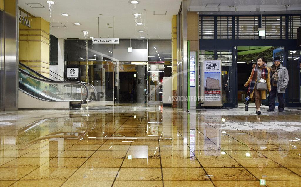 Uncredited Water covers a floor of Fukushima station as it leaks from a ceiling following an earthquake in Fukushima, northeastern Japan Saturday, Feb. 13, 2021. A strong earthquake hit off the coast of northeastern Japan late Saturday, shaking Fukushima, Miyagi and other areas, but there was no threat of a tsunami, officials said. (Kyodo News via AP)