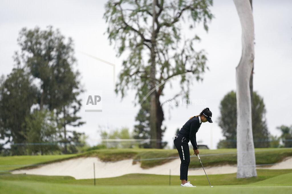Ashley Landis Patty Tavatanakit putts on the 10th green during the second round of the LPGA's Hugel-Air Premia LA Open golf tournament at Wilshire Country Club Thursday, April 22, 2021, in Los Angeles. (AP Photo/Ashley Landis)