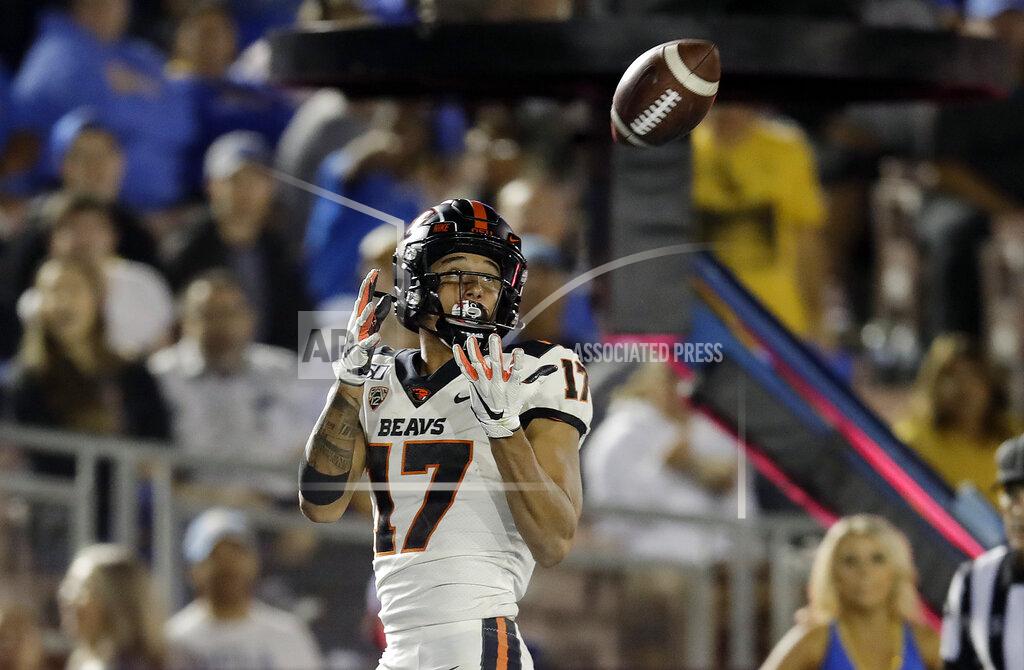 Marcio Jose Sanchez Oregon State wide receiver Isaiah Hodgins (17) catches a pass for a touchdown against UCLA during the second half of an NCAA college football game Saturday, Oct. 5, 2019, in Pasadena, Calif. (AP Photo/Marcio Jose Sanchez)