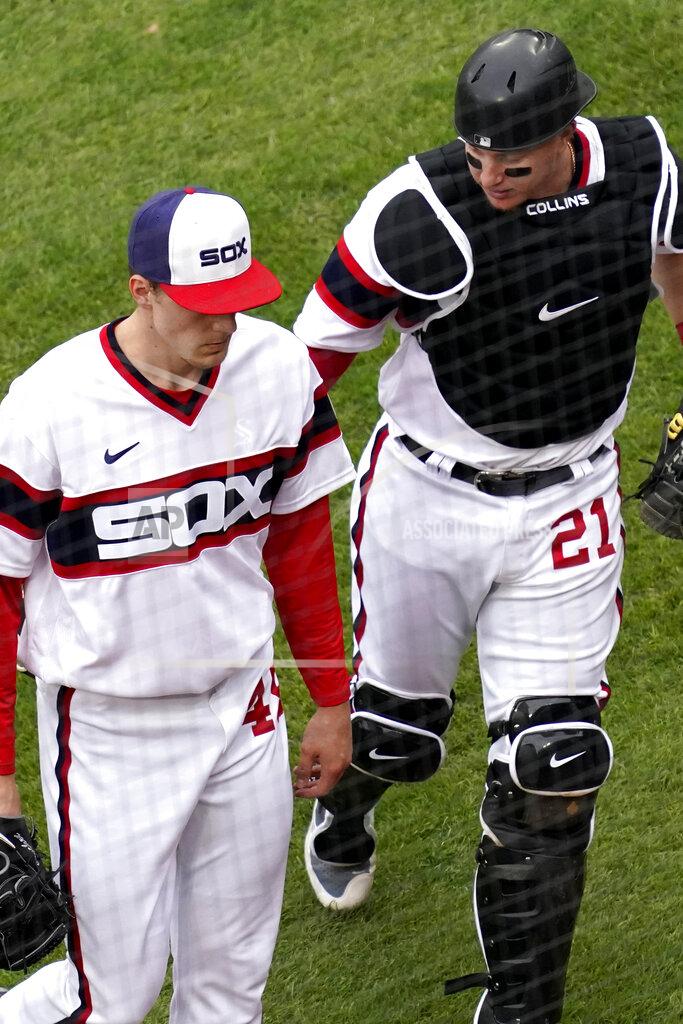 Nam Y. Huh Chicago White Sox catcher Zack Collins, right, talks to relief pitcher Garrett Crochet as they walk to the dugout during the 10th inning of a baseball game against the Kansas City Royals in Chicago, Sunday, April 11, 2021. (AP Photo/Nam Y. Huh)