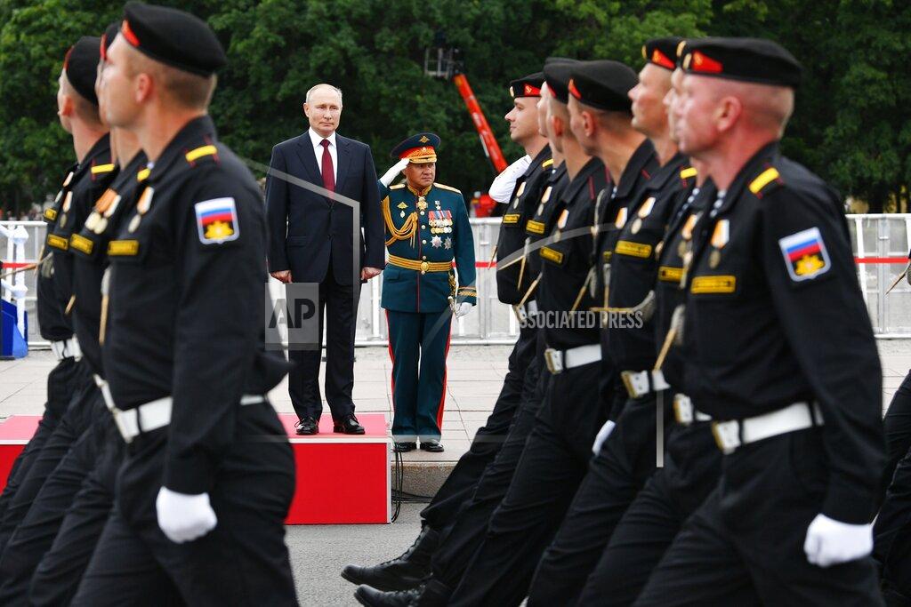 Alexei Nikolsky Russian President Vladimir Putin, left, Russian Defense Minister Sergei Shoigu, center, attend the Navy Day parade in St.Petersburg, Russia, Sunday, July 25, 2021. (Alexei Nikolsky, Sputnik, Kremlin Pool Photo via AP)