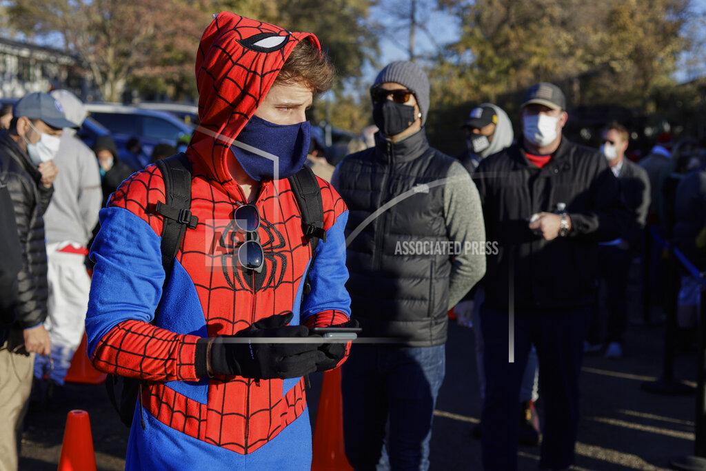 Nati Harnik Colin Buckley of Omaha wears a Spiderman suit as he waits to cast an early vote on Halloween, at the Douglas County Election Commission office in Omaha, Neb., Saturday, Oct. 31, 2020. (AP Photo/Nati Harnik)