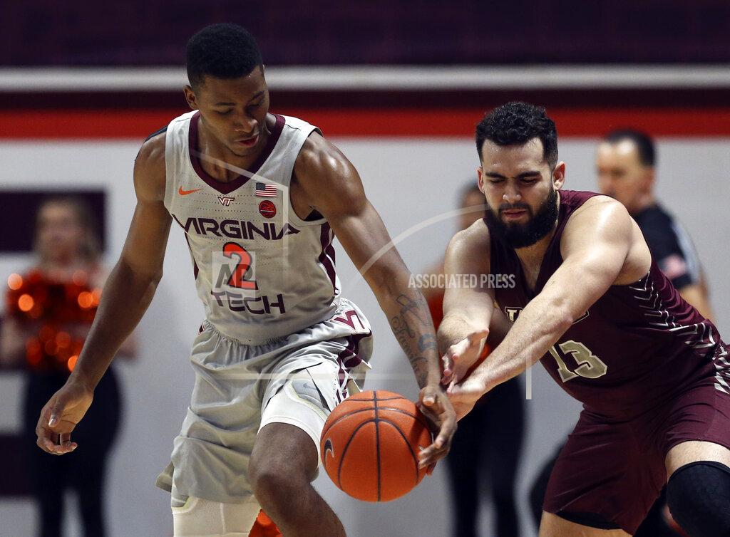 Matt Gentry Virginia Tech's Landers Nolley II (2) has the ball tipped from behind by Maryland-Eastern Shore's Bryan Urrutia (13) in the first half of an NCAA college basketball game in Blacksburg, Va., Sunday, Dec. 29 2019. (Matt Gentry/The Roanoke Times via AP)