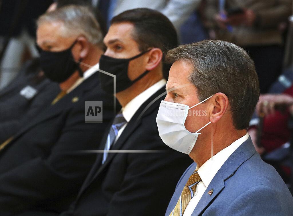 Curtis Compton Georgia Gov. Brian Kemp (front to back), Lt. Gov. Geoff Duncan, and House Speaker David Ralston, along with legislators and EMC companies, hold a press conference about expanding internet access in Georgia on Monday, Feb 8, 2021, at the Georgia Capitol in Atlanta. (Curtis Compton/Atlanta Journal-Constitution via AP)