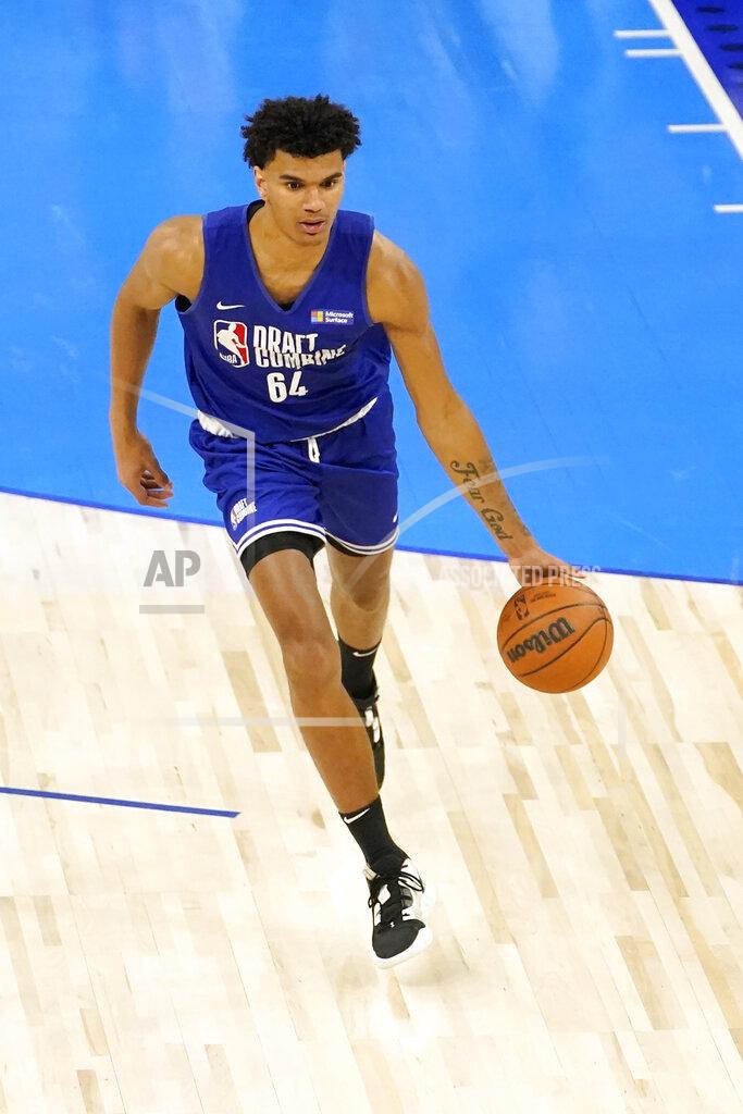 Charles Rex Arbogast Dominick Barlow participates in the NBA basketball draft combine Wednesday, May 18, 2022, in Chicago. Barlow is one of the 76 prospects at the combine. But he didn't take the conventional route through the college ranks. Or the NBA's G League Ignite. Or playing overseas. He turned down college offers to receive on-the-job training through Overtime Elite, a new basketball league created to give high school players another path to the pros. He got paid -- a six-figure salary -- as he learned about nutrition, social-media skills, financial literacy and, of course, the art of basketball. (AP Photo/Charles Rex Arbogast)