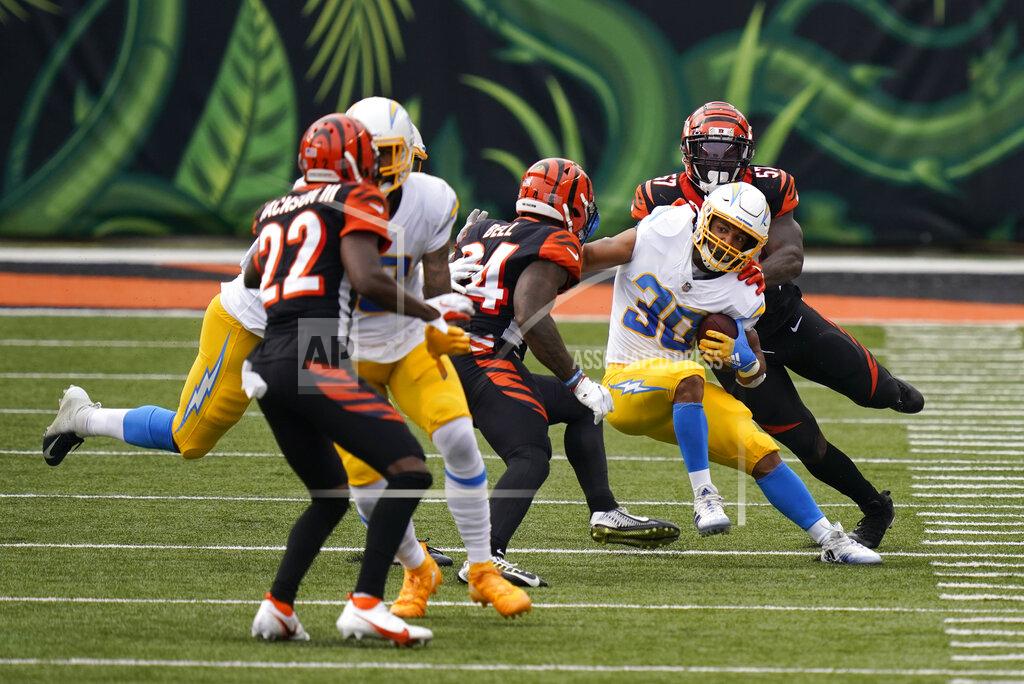Bryan Woolston Los Angeles Chargers running back Austin Ekeler (30) is tackled by Cincinnati Bengals linebacker Germaine Pratt (57) during the first half of an NFL football game, Sunday, Sept. 13, 2020, in Cincinnati. (AP Photo/Bryan Woolston)