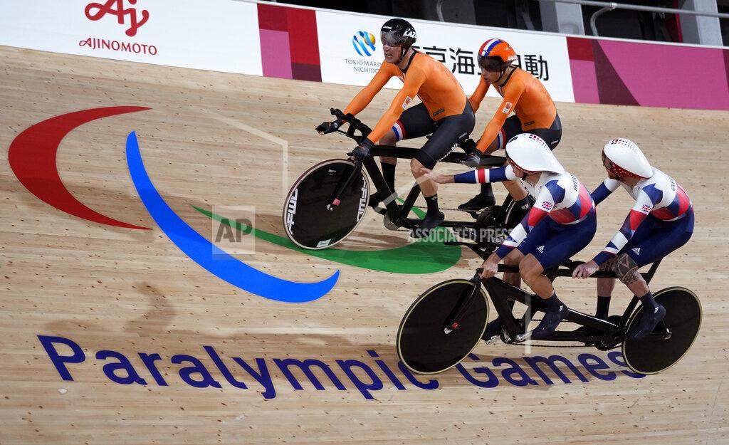Shuji Kajiyama FILE - In this Aug. 25, 2021, file photo, Tristan Bangma, top right, and his pilot Patrick Bos, top left, of the Netherlands compete with Britain's Adam Duggleby, right, and his pilot Stephen Bate in the Cycling Track men's B 4000m Individual Pursuit final at the Tokyo 2020 Paralympic Games in Izu, Shizuoka prefecture, Japan. There are 4,403 Paralympic athletes competing in Tokyo, each with unique differences that have to be classified. Lines have to be draw, in the quest for fairness, to group similar impairments, or impairments that yield similar results. (AP Photo/Shuji Kajiyama)