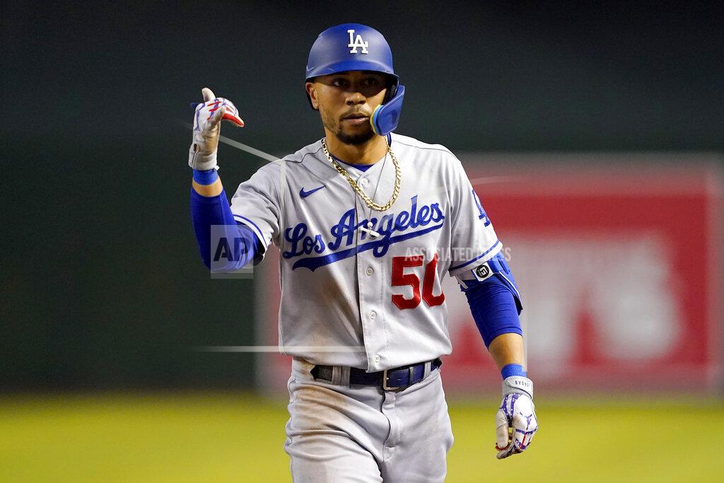 Matt York Los Angeles Dodgers' Mookie Betts (50) motions to his dugout after a base hit against the Arizona Diamondbacks during the sixth inning of a baseball game, Thursday, May 26, 2022, in Phoenix. (AP Photo/Matt York)