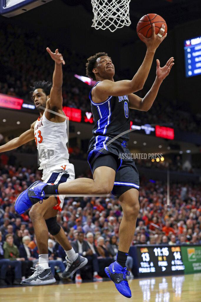 Andrew Shurtleff Duke forward Wendell Moore Jr. (0) shoots as Virginia guard Tomas Woldetensae (53) defends during an NCAA college basketball game Saturday, Feb. 29, 2020, in Charlottesville, Va. (AP Photo/Andrew Shurtleff)