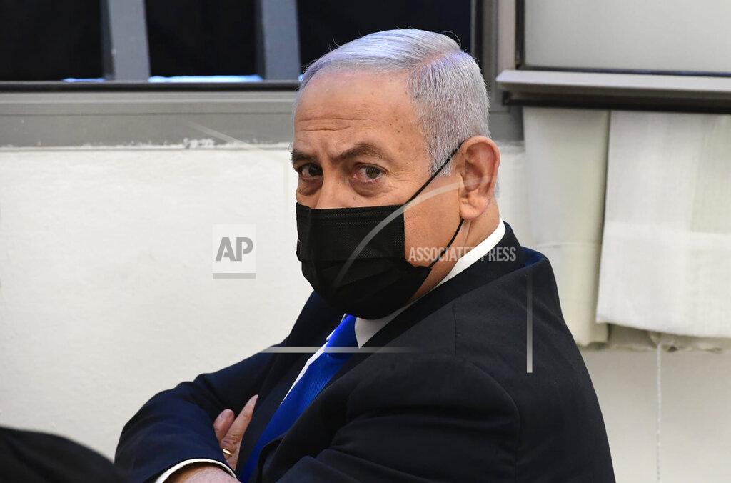 Reuven Castro Israeli Prime Minister Benjamin Netanyahu looks on prior to a hearing at the district court in Jerusalem, Monday, Feb. 8, 2021. Netanyahu appeared in a Jerusalem courtroom Monday to respond formally to corruption charges just weeks before national elections in which he hopes to extend his 12-year rule. (AP Photo/Reuven Castro, Pool)