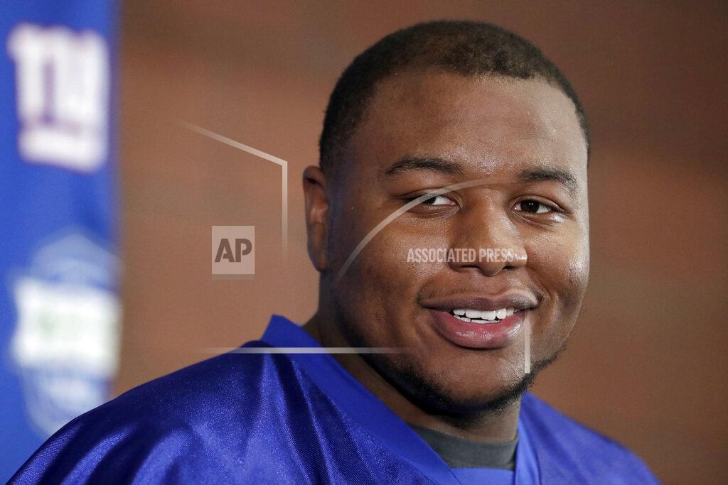Julio Cortez FILE - New York Giants first round draft pick Dexter Lawrence talks to reporters during NFL football rookie camp, Friday, May 3, 2019, in East Rutherford, N.J. Lawrence has the simplest of goals for his second season with the Giants. The second of three Giants’ first-round draft picks in 2019 wants to be noticed in the fourth quarter of games this season. He started all 16 games in 2019 and finished with 38 tackles, 2 1/2 sacks, a forced fumble and nine quarterback hits on a 4-12 team. Talking to the media Tuesday, Aug. 18, 2020 for the first time since camp opened, Lawrence wasn't satisfied with his first NFL season. (AP Photo/Julio Cortez)