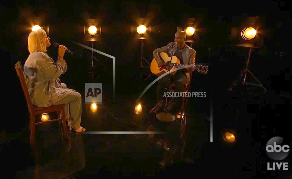 Uncredited In this screen shot provided by ABC on Sunday, Nov. 22, 2020, Katy Perry, left, and Darius Rucker perform “Only Love” at the American Music Awards at the Microsoft Theater in Los Angeles. (ABC via AP)
