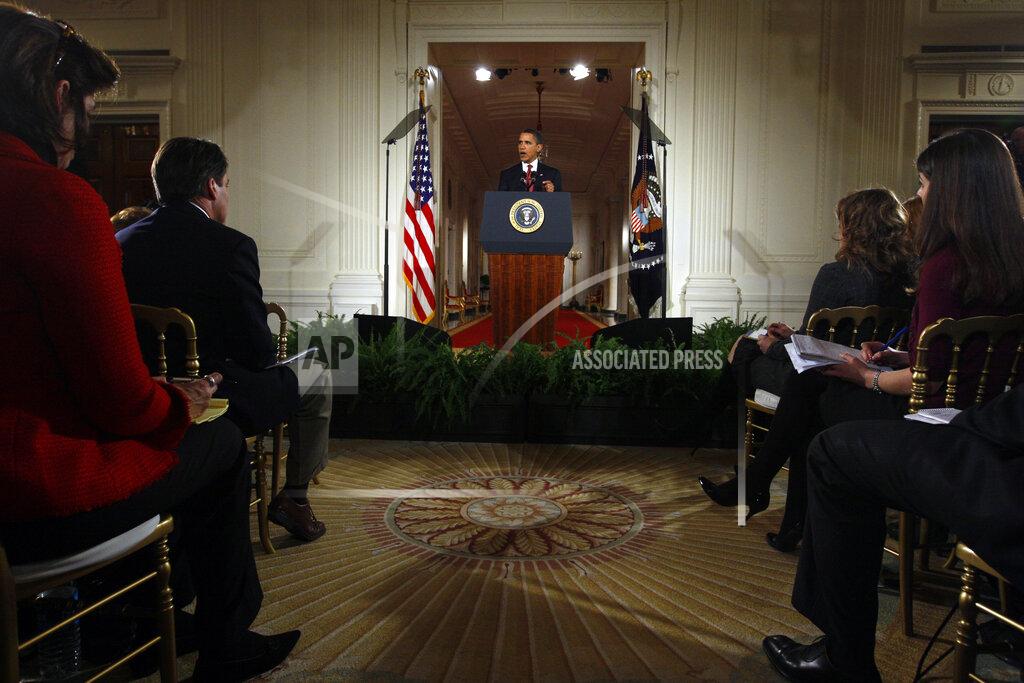 Charles Dharapak FILE - In this Feb. 9, 2009, file photo President Barack Obama delivers opening remarks during his first prime time televised news conference in the East Room of the White House in Washington. (AP Photo/Charles Dharapak, File)
