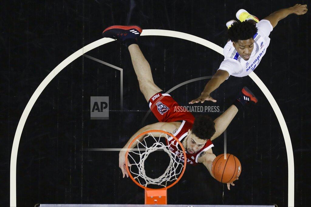 Frank Franklin Ii North Carolina State's Devon Daniels (24) drives past Memphis' Jayden Hardaway (25) during the second half of an NCAA college basketball game in the Barclays Classic, Thursday, Nov. 28, 2019, in New York. (AP Photo/Frank Franklin II)