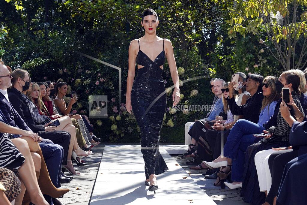 Richard Drew The Michael Kors Spring/Summer 2022 collection is modeled during Fashion Week in New York, Friday, Sept. 10, 2021. (AP Photo/Richard Drew)