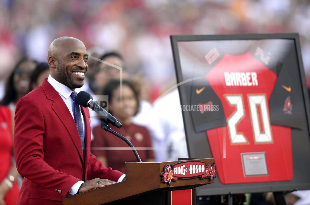Jason Behnken Former Tampa Bay Buccaneers player Ronde Barber smiles as he is inducted in the team's Ring of Honor during halftime of an NFL football game against the New York Giants Sunday, Sept. 22, 2019, in Tampa, Fla. (AP Photo/Jason Behnken)