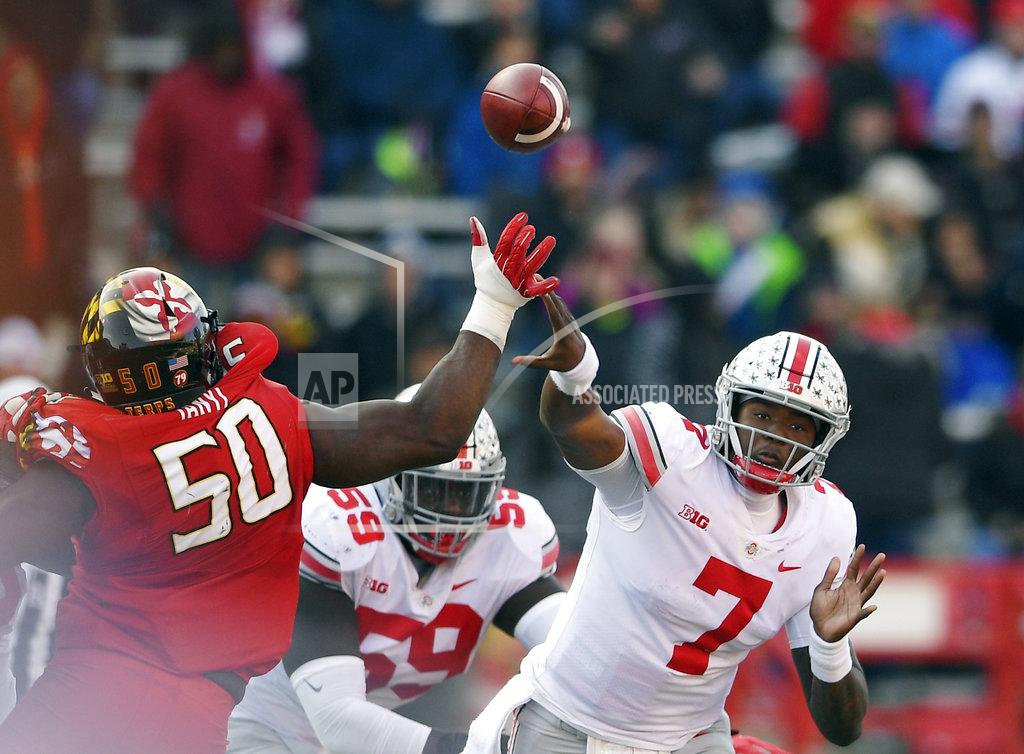 Nick Wass Ohio State quarterback Dwayne Haskins Jr. (7) passes under pressure from Maryland linebacker Mbi Tanyi (50) during the second half of an NCAA football game, Saturday, Nov. 17, 2018, in College Park, Md. Ohio State won 52-51 in overtime. (AP Photo/Nick Wass)