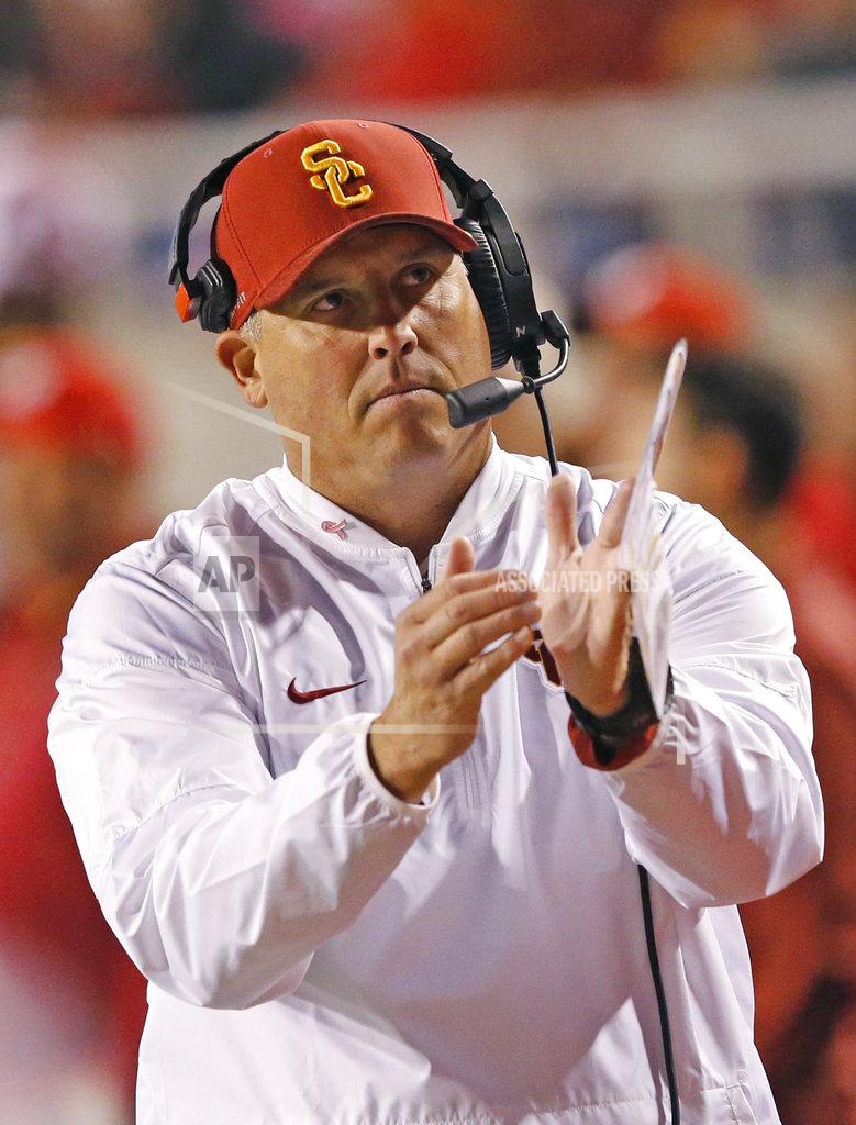 Rick Bowmer Southern California head coach Clay Helton calls for a time out in the first half during an NCAA college football game against Utah Saturday, Oct. 20, 2018, in Salt Lake City. (AP Photo/Rick Bowmer)