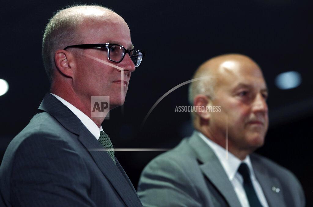 David Zalubowski Joe Parker, left, athletic director at Colorado State University, considers a question as Steve Addazio looks on during an announcement that Addazio has been hired as the new head football coach at the school at a news conference Thursday, Dec. 12, 2019, in Fort Collins, Colo. (AP Photo/David Zalubowski)