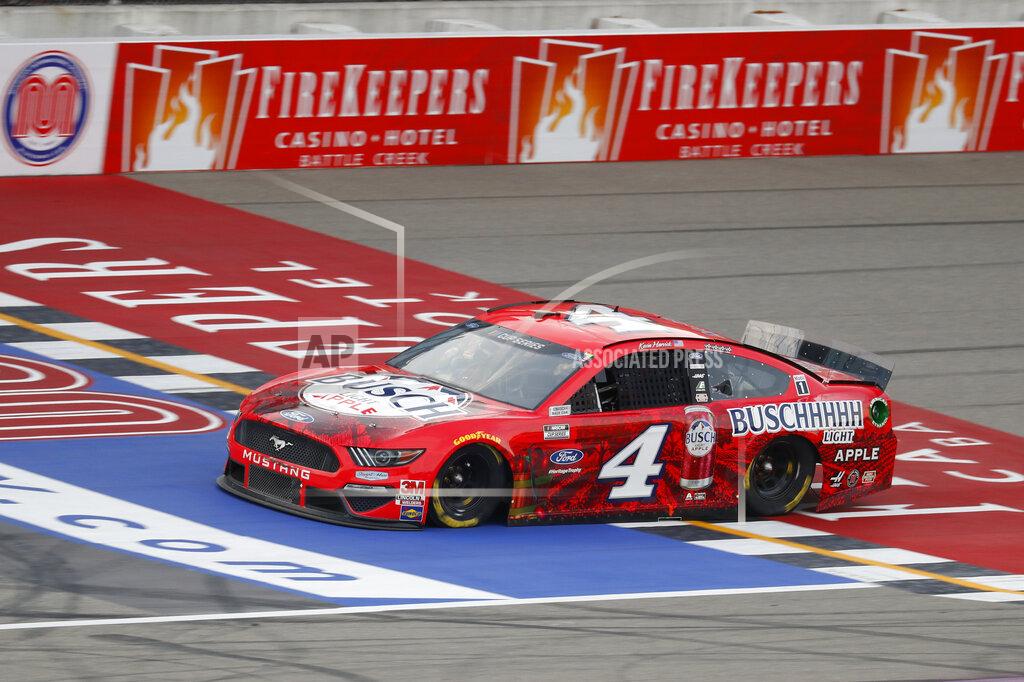 Paul Sancya Kevin Harvick crosses the finish line during a NASCAR Cup Series auto race at Michigan International Speedway in Brooklyn, Mich., Saturday, Aug. 8, 2020. (AP Photo/Paul Sancya)