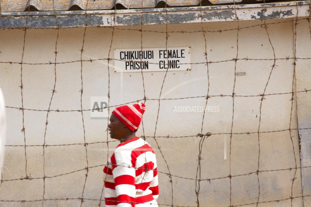 Tsvangirayi Mukwazhi A female prisoner is seen inside the prison premises at Chikurubi prison on the outskirts of Harare, Saturday, April 17, 2021. Zimbabwe began the release of about 3,000 prisoners under a presidential amnesty aimed at easing congestion and minimizing the threat of COVID-19 across the country's overcrowded jails. (AP Photo/Tsvangirayi Mukwazhi)